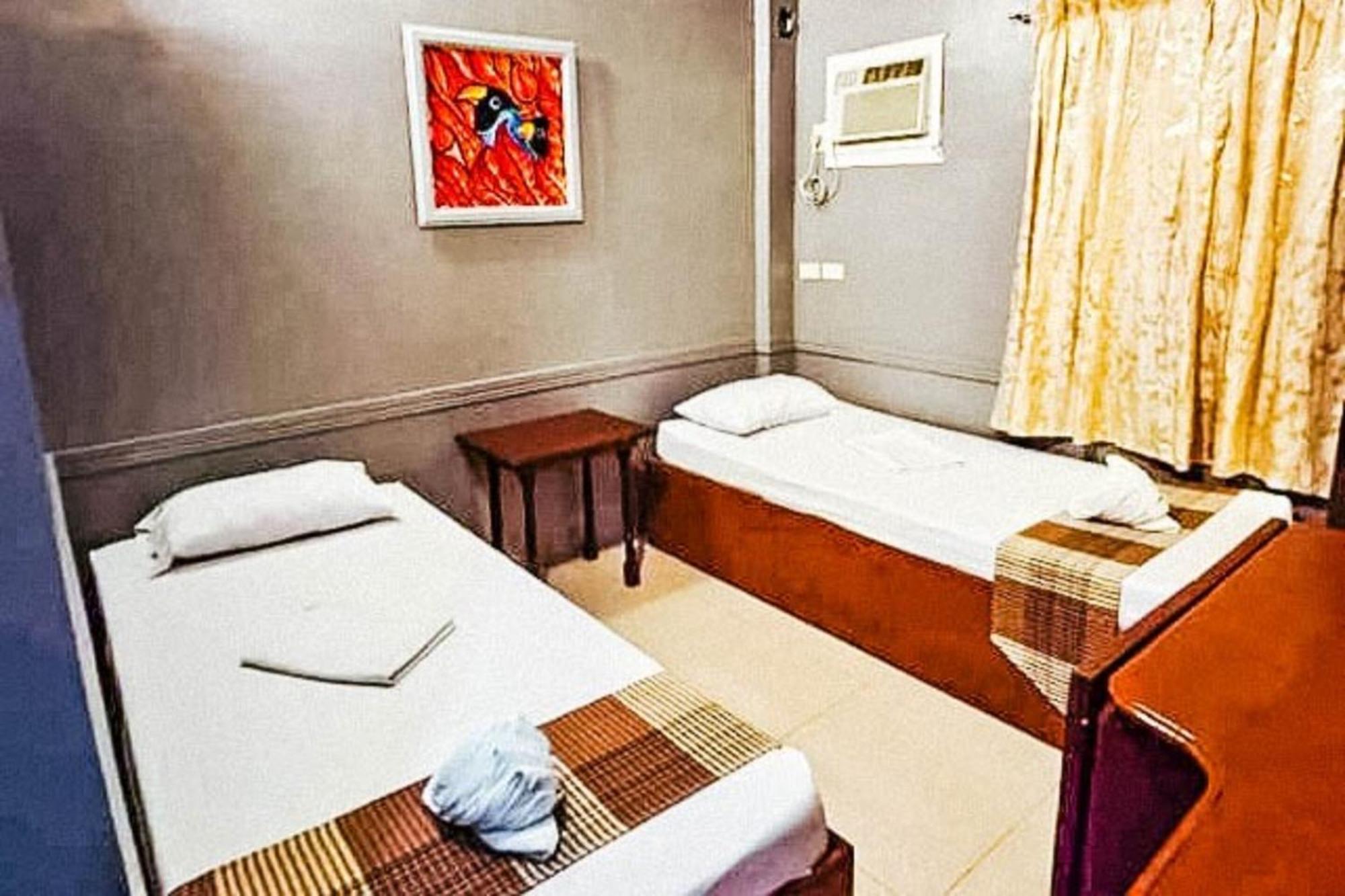 Mbg Travellers Inn Powered By Cocotel Puerto Princesa Phòng bức ảnh